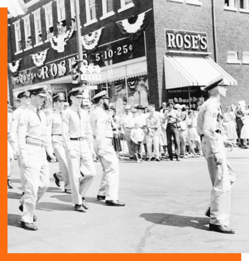Roses Story - American Soldiers marching in parade in front of Roses 